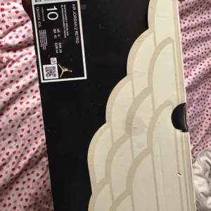 Air Jordan 2 Retro Sneakers - Black and Cream