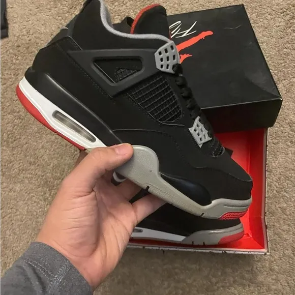 Black and Gray Sneakers with Red Accents