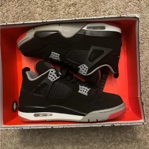 Black and Gray Sneakers with Red Accents