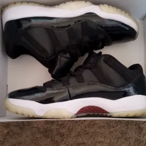 Black and White Low Top Jordan 11 Mens Sneakers Size 10