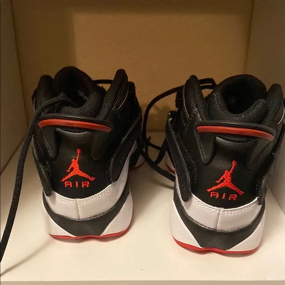Black and White Sneakers with Red Accents