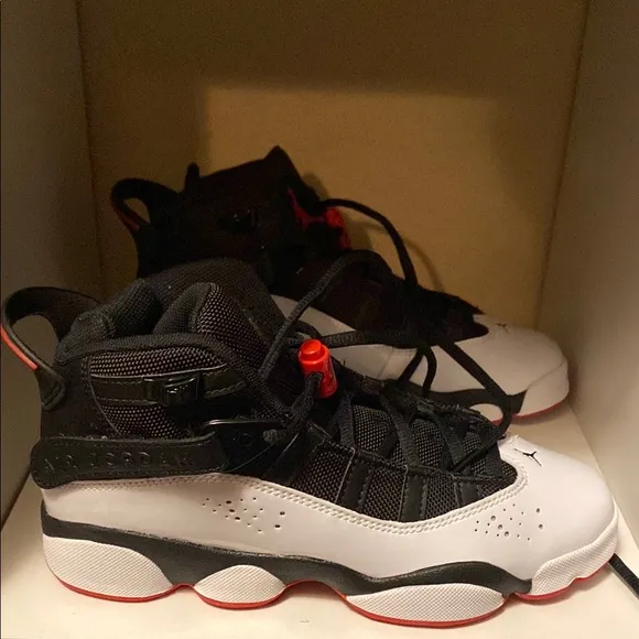 Black and White Sneakers with Red Accents
