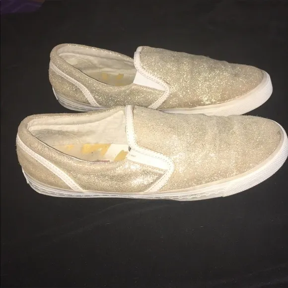 Gold slip on sneakers by Isaac Mizrahi