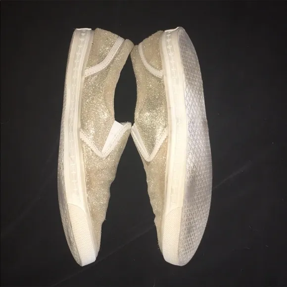 Gold slip on sneakers by Isaac Mizrahi