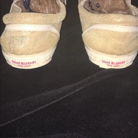 Gold slip on sneakers by Isaac Mizrahi