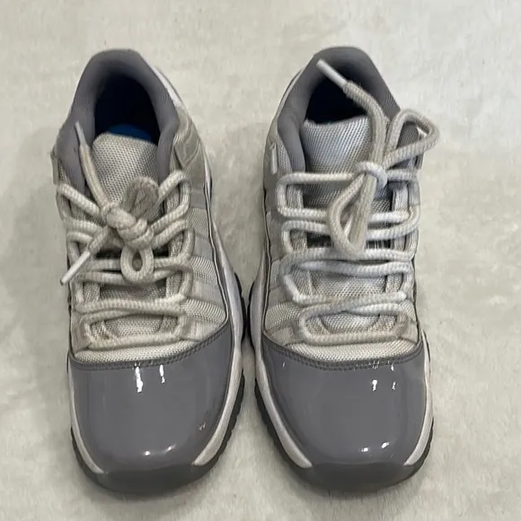 JORDAN 11 Retro Low Cement Gray and White Sneakers
