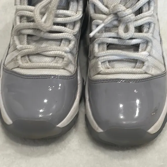 JORDAN 11 Retro Low Cement Gray and White Sneakers