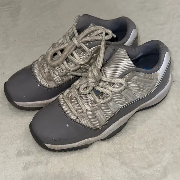 JORDAN 11 Retro Low Cement Gray and White Sneakers