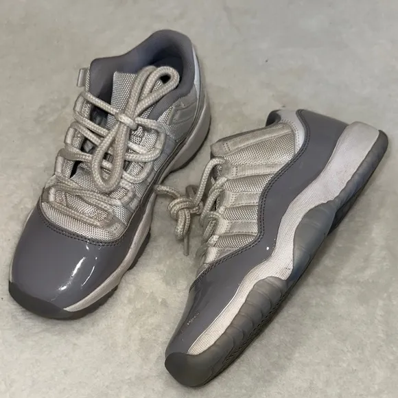 JORDAN 11 Retro Low Cement Gray and White Sneakers
