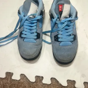 Light Blue Sneakers with Black Accents