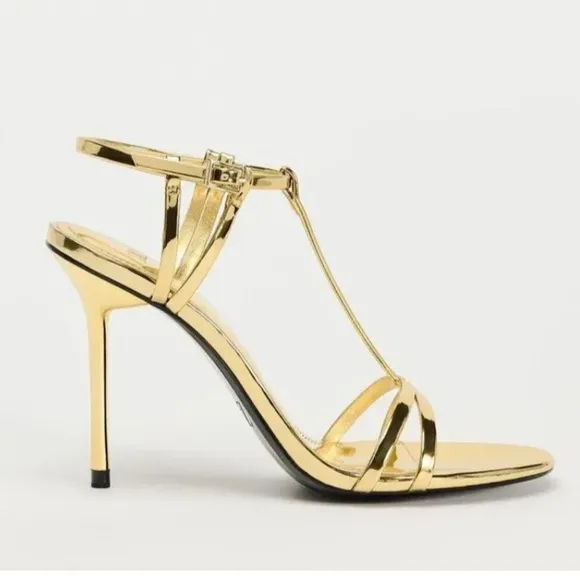 Metallic high-heel with ankle straps. Elegant Gold Stiletto Sandals.