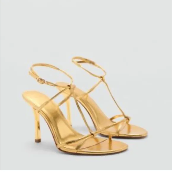 Metallic high-heel with ankle straps. Elegant Gold Stiletto Sandals.