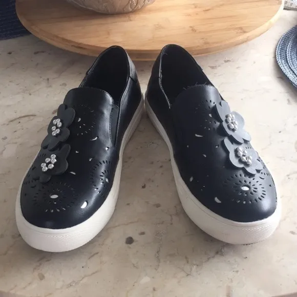Nanette Lepore Whitney black with floral cut outs and beaded closed toe shoe