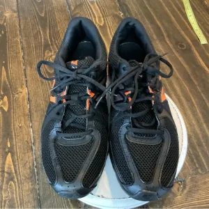 New Balance Black and Orange Athletic Sneakers