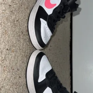 Nike Black and White Sneakers with Pink Swoosh