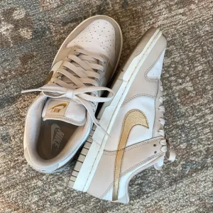 Nike Dunk Low “Phantom Metallic Gold” Sneakers