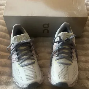 On Running White and Gray Sneakers