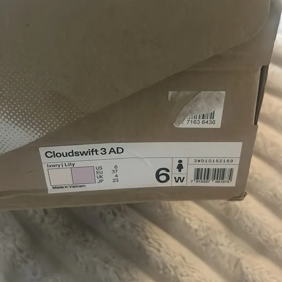 On Running White and Gray Sneakers