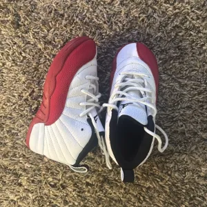 Red and White Nike Air Jordan 12 Sneakers