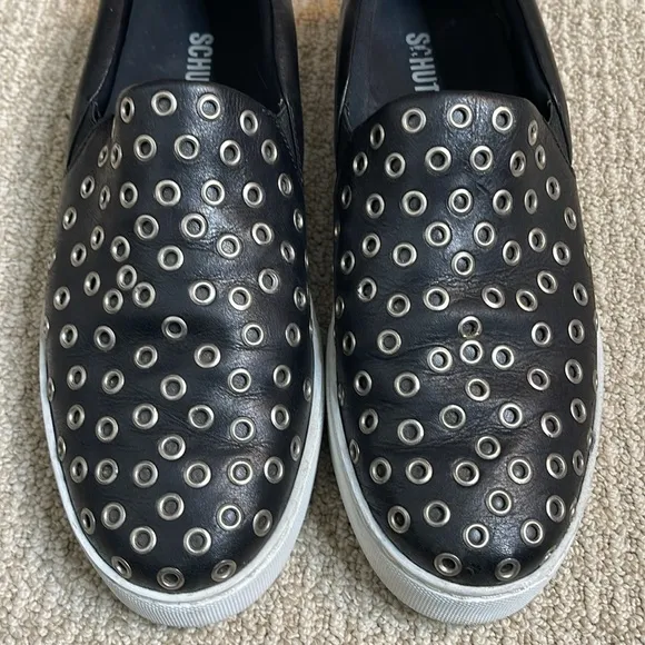SCHUTZ GROMMET STUDDED BLACK LEATHER SLIP ON SNEAKERS