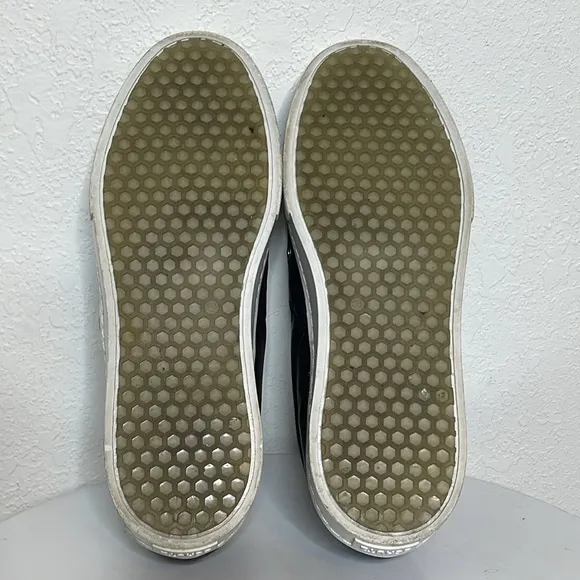 SCHUTZ GROMMET STUDDED BLACK LEATHER SLIP ON SNEAKERS