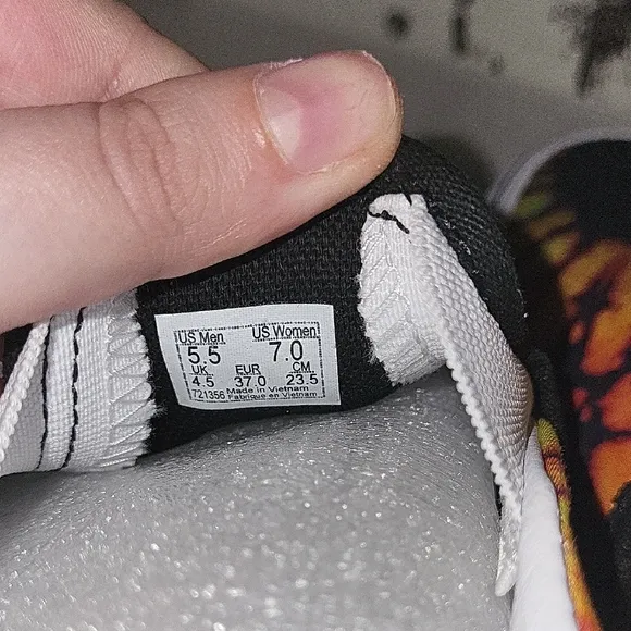 Vans Black and Orange Slip-On Platform Sneakers with Psychedelic Design
