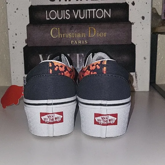 Vans Black and Orange Slip-On Platform Sneakers with Psychedelic Design