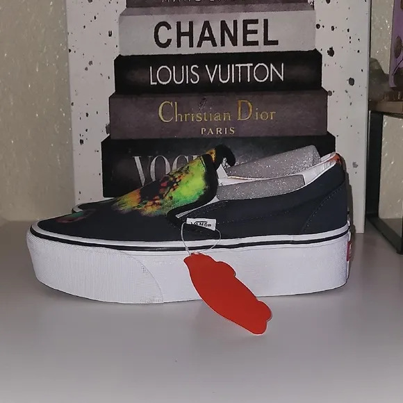 Vans Black and Orange Slip-On Platform Sneakers with Psychedelic Design