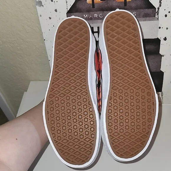 Vans Black and Orange Slip-On Platform Sneakers with Psychedelic Design