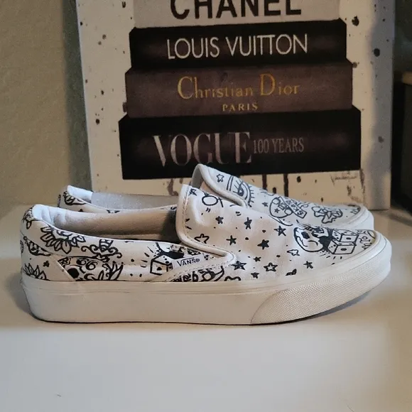 Vans White and Black Graphic Slip-On Sneakers