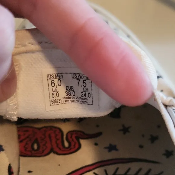 Vans White and Black Graphic Slip-On Sneakers