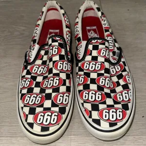 Vans X Supreme Slip-On Sneakers with 666 Design