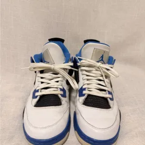 White and Blue Jordan 4’s