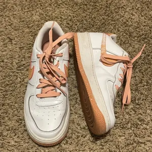 White and Pink Nike Sneakers