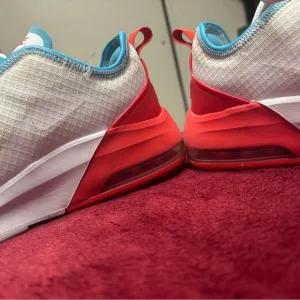 White and Red Sneakers with Blue Accents