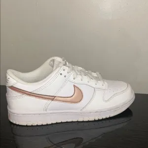 White and Rose Gold Nike Sneakers