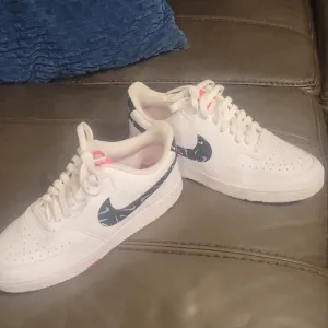 White Sneakers with Black Swoosh